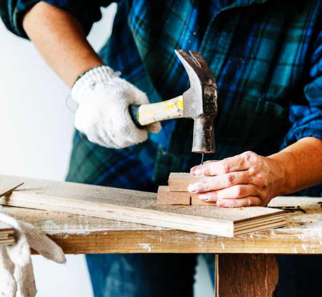 Person Hammering a Nail